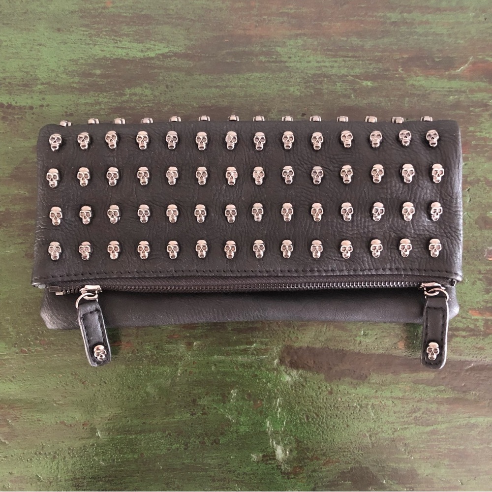 Clutch; black; skulls; new (never used).